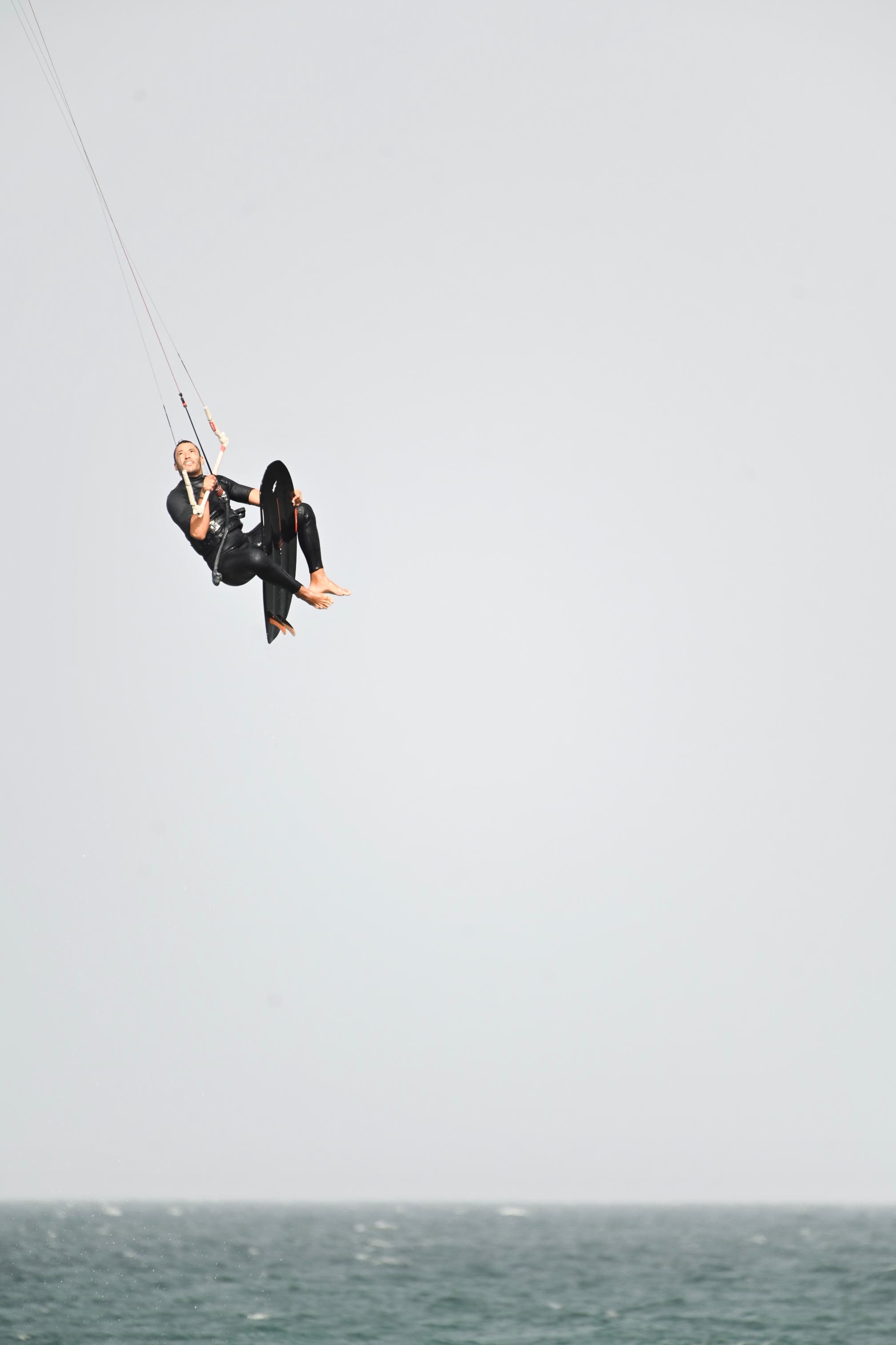 Kitesurfer flying high above the Atlantic