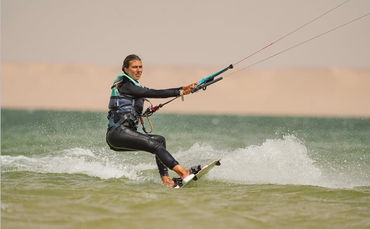 Kitesurfer riding in flat water